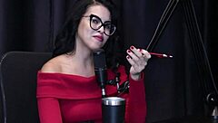 Annie Clementine records a group event with family support in sheer red.