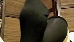 a woman in pantyhose and stockings relaxes at home