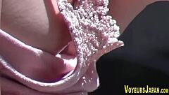 Asian babes have their side boobs spied on by a voyeur outdoors