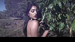 Is this sexy model topless in an outdoor photoshoot teasing you?