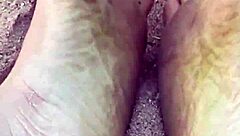 Barefoot Beauty Teases in Natural Sand Setting