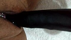 Wife playfully uses dildo at home, amateurs having fun! 😏