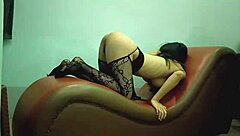 Asian friend relaxes on sofa chair