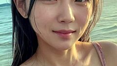 mature woman strolling on the beach