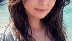 mature woman strolling on the beach