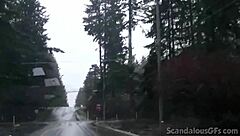 a redhead teen relaxes in the car outdoors