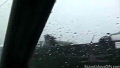 a redhead teen relaxes in the car outdoors