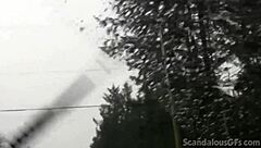 a redhead teen relaxes in the car outdoors