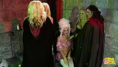 Instead of crowning, lesbians finger blonde in dungeon group sex