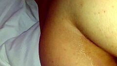 The girl inserts a toy into her rear in a simple scene.