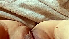 Milf opens her pussy wide.