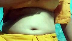 Watch her masturbate under the ghunghat, teasing her pussy.