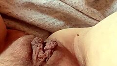 Milf opens her pussy wide.