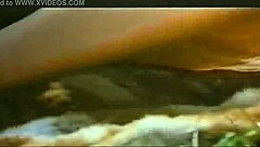 The mature redhead eagerly sucks the monster cock, her big tits bouncing with each thrust.