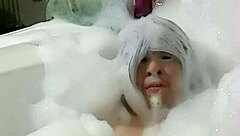 Cyno enjoys solo bubble bath fun in cosplay.