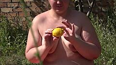 The russian bbw bodybuilder pushes a lemon from her hairy pussy, revealing a gaping hole with muscular vagina