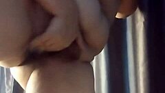 Arriving home, I relax with belly masturbation and orgasm.