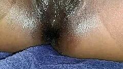 Black ebony woman masturbates in close up