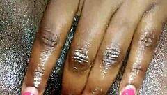 Black ebony woman masturbates in close up