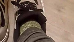 Why is my friend having so much fun trashing my sneakers? Provocative foot fetish scene.