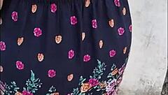 Stalking mature Latina in skirt and thong on public street