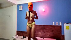my brunette stepsister tells me she wants to celebrate halloween in a hotel bed she put on a mask and shakes her body and hips very sexy finally she getts naked for me