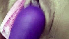 beautiful latina relaxes with self-massage on rainy afternoon