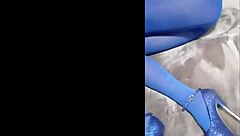 admiring sexy pantyhose paired with blue high heels