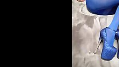 admiring sexy pantyhose paired with blue high heels