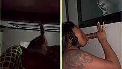 She sucks strangers' big black cocks through the gloryhole, spitting and getting facials