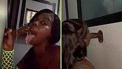 She sucks strangers' big black cocks through the gloryhole, spitting and getting facials