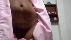 The black wife dances seductively for her lover on the marital bed, eager for his cum.