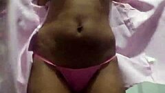 The black wife dances seductively for her lover on the marital bed, eager for his cum.