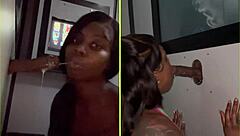 She sucks strangers' big black cocks through the gloryhole, spitting and getting facials