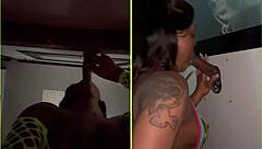 She sucks strangers' big black cocks through the gloryhole, spitting and getting facials