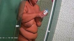 Hidden camera catches brazilian milf neighbor shaving her pussy