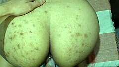 I bend over the beautiful brunette on the sofa.