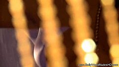 She dances the erotic veil striptease.