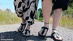 this mature german woman goes barefoot in birkenstocks through the european outdoor nature, enjoying a public fetish vibe.