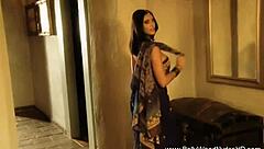 She dances the erotic veil striptease.