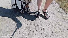 this mature german woman goes barefoot in birkenstocks through the european outdoor nature, enjoying a public fetish vibe.