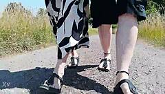 this mature german woman goes barefoot in birkenstocks through the european outdoor nature, enjoying a public fetish vibe.