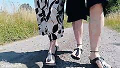 this mature german woman goes barefoot in birkenstocks through the european outdoor nature, enjoying a public fetish vibe.