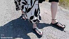 this mature german woman goes barefoot in birkenstocks through the european outdoor nature, enjoying a public fetish vibe.