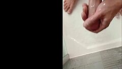 Blonde bodybuilder showers her muscular cock.