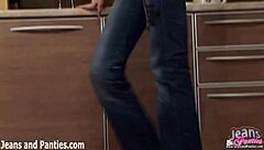 Tatiana wears pigtails with tight blue jeans