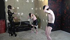 Japanese dominatrix yuen tests slaves in a whipping contest