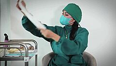 nurse uses latex gloves in hospital fetish play