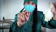 nurse uses latex gloves in hospital fetish play