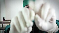 nurse uses latex gloves in hospital fetish play